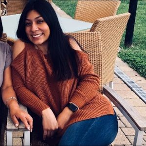 Open shoulder knitted sweater